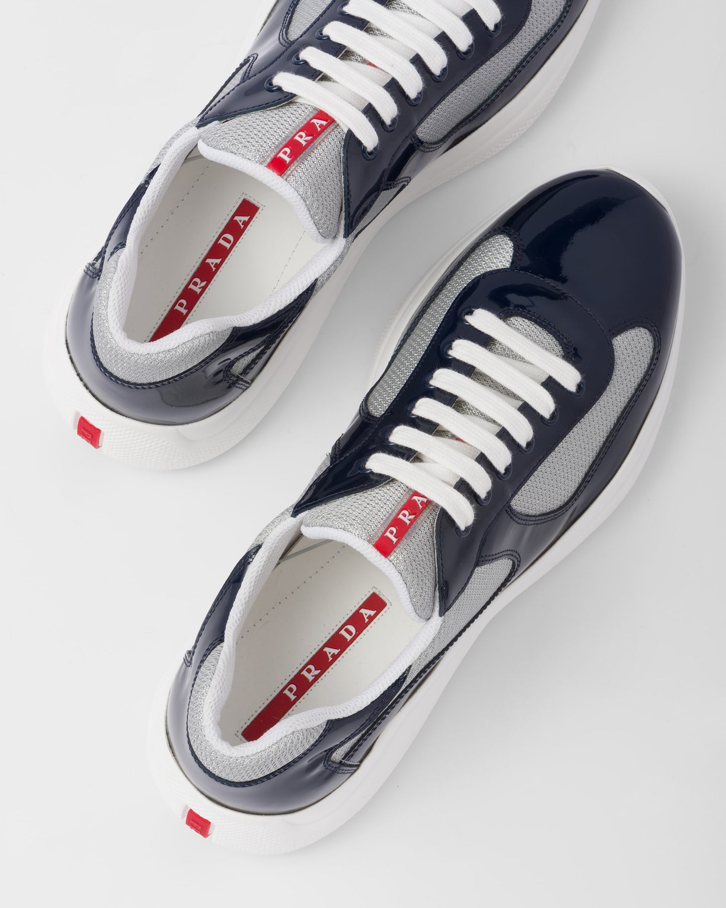 Sneakers Prada America's Cup en cuir verni et tissu technique