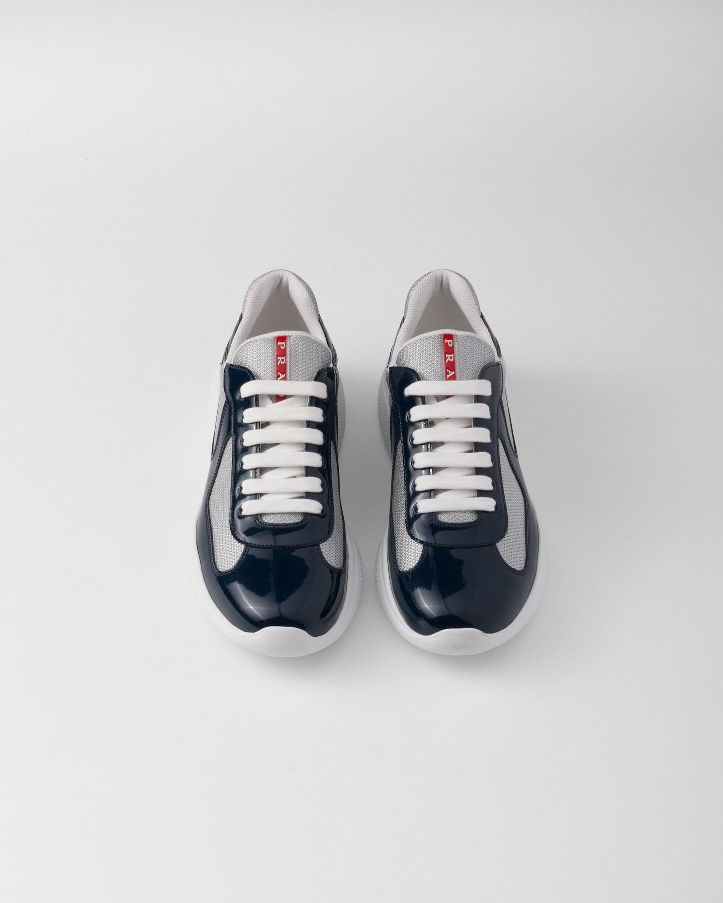 Sneakers Prada America's Cup en cuir verni et tissu technique